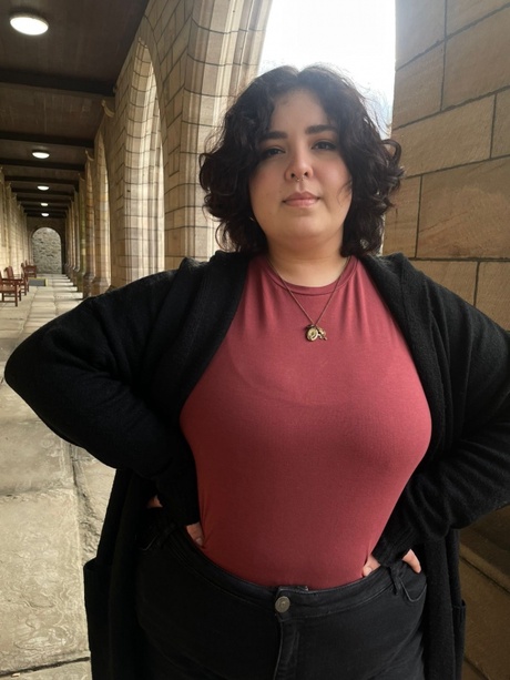 Romina standing under the arches at Elphinstone Hall