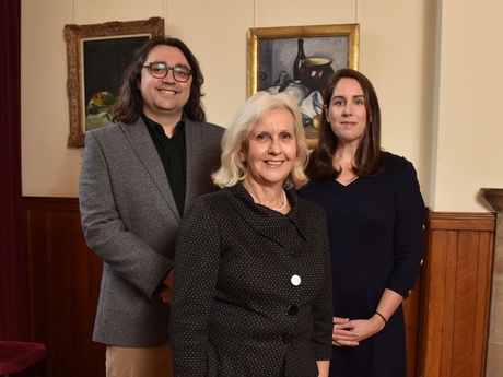 The representatives of the Law School standing together in a foyer at the School