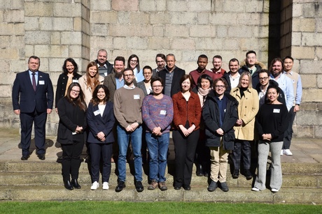 Delegates in a group outside King's Conference Centre