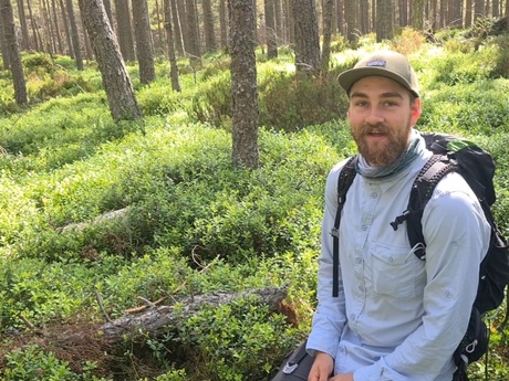 Lead researcher Jack Bamber in the woods where capercaillie nest