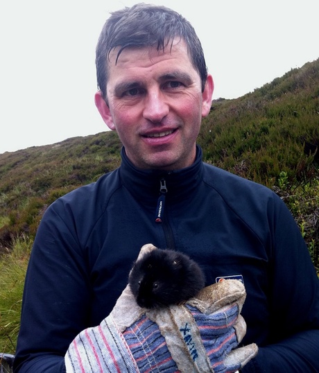 Professor Xavier Lambin with a water vole