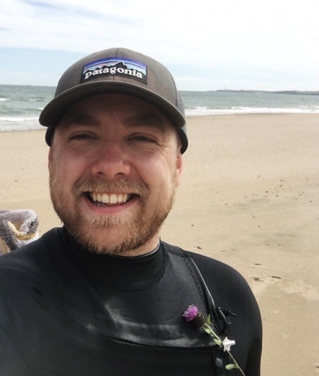 Person on beach wearing a hat