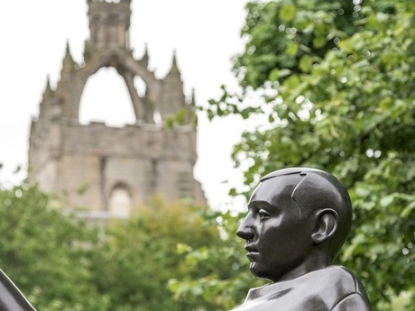 Statue at Old Aberdeen campus with the King's College crown in the background