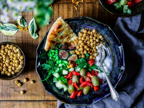 An aerial look at a bowl of food on a table