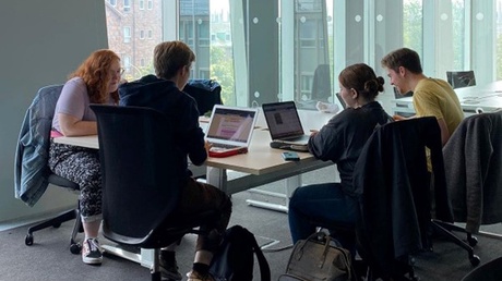 Museum Studies students working together in the Sir Duncan Rice Library