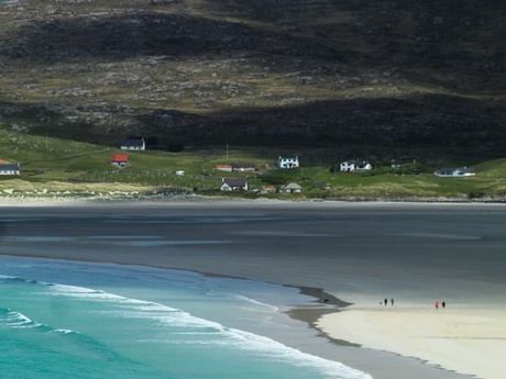 A beach on the Isle of Harris with mountains in the background