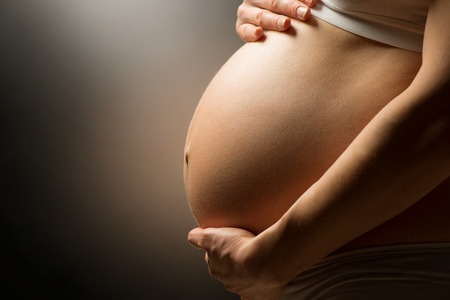 image shows a pregnant woman