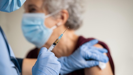 Older person being vaccinated