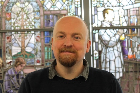 Alan Walker in front of the Stained Glass Window