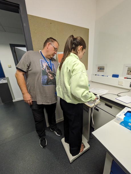 Dave helping a student on the Tanita machine