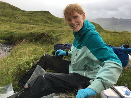 Laura in the field handling a water vole