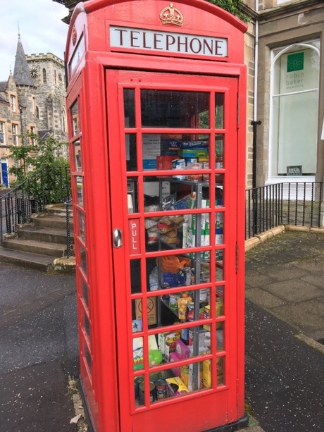 Disused telephone box repurposed as a larder