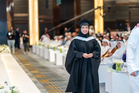 Graduate walking to the stage