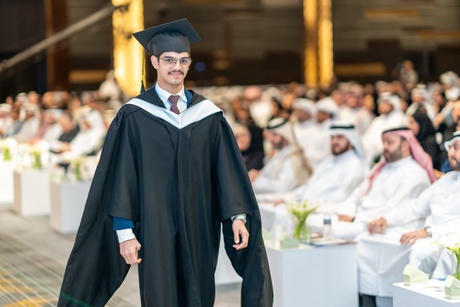 Graduate walking to the stage