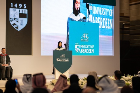 Graduate giving a speech on the stage