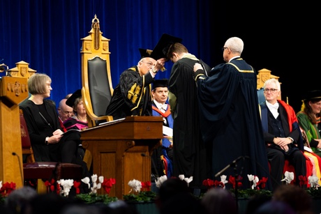 Student being capped on stage