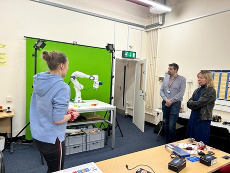 Student demonstrating a robot