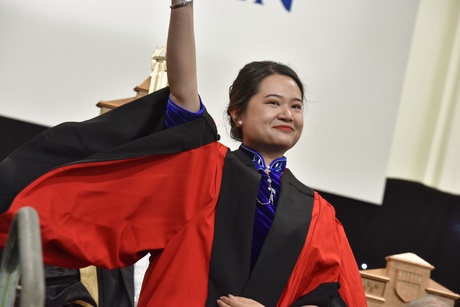 Woman smiling on the graduation stage