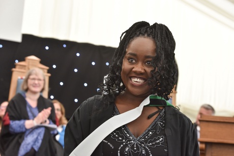 Woman smiling on stage