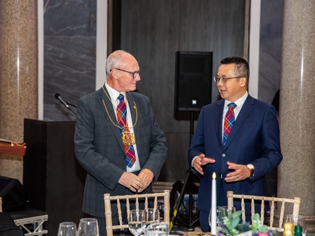 Two men in suits talking