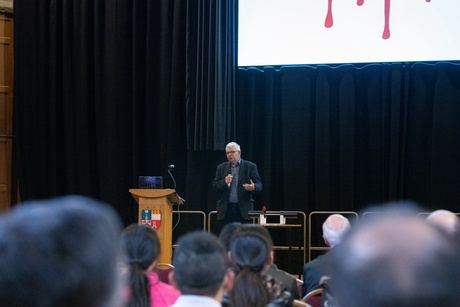 A man on stage speaking