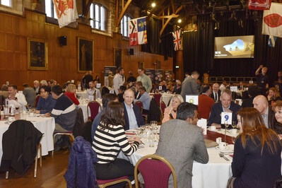 People sitting at tables in Elphinstone Hall