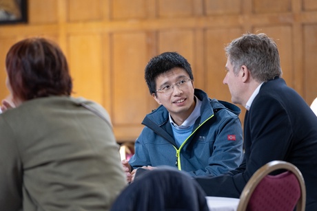 People speaking at a table