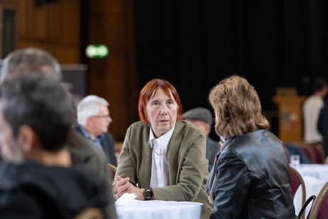 Someone sitting at a table at the 100 years of engineering event