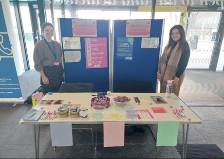 GBV pop-up in the Sir Duncan Rice Library. Left to right: Holly Turner (Emily Drouet Intern) and Iona Rae (Graduate Trainee).