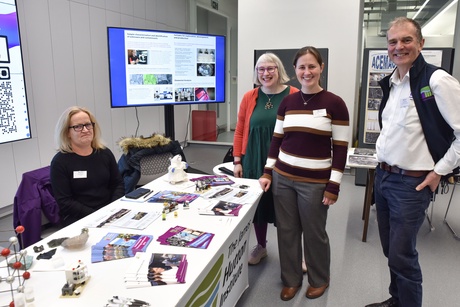 People smiling at the James Hutton Institute stand