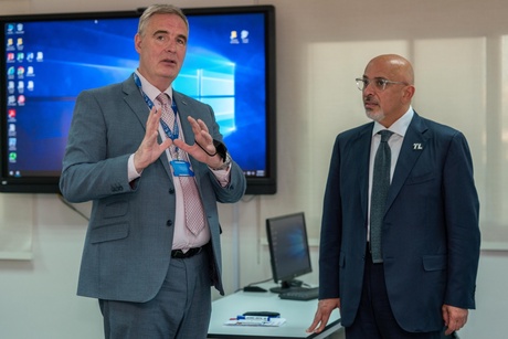 College principal and the Education Secretary touring the campus