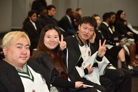 Students give the peace sign