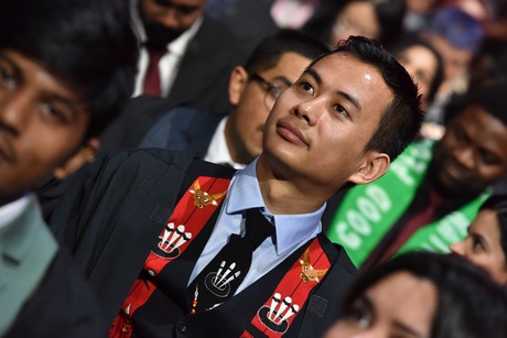 A student waiting for the ceremony to begin