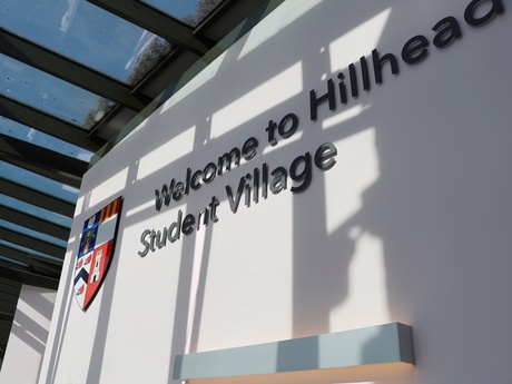 A sign that reads Welcome to Hillhead Student Village