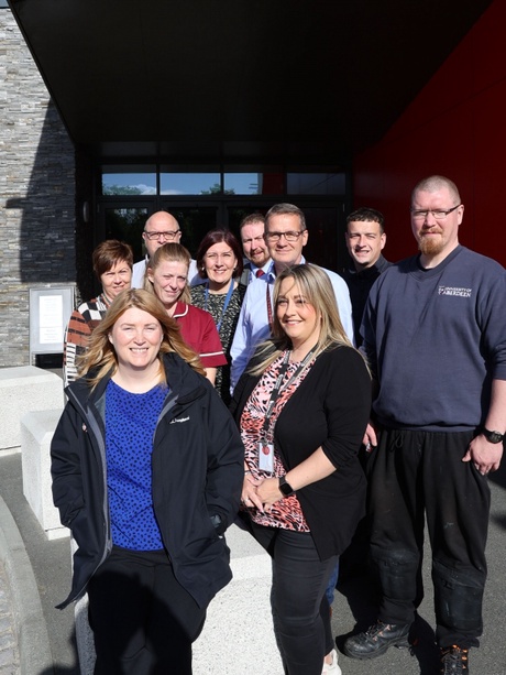 A group of people standing outside a building