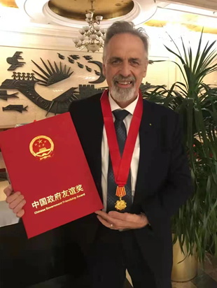 John Speakerman receiving the China Friendship Award in the Great Hall of the People