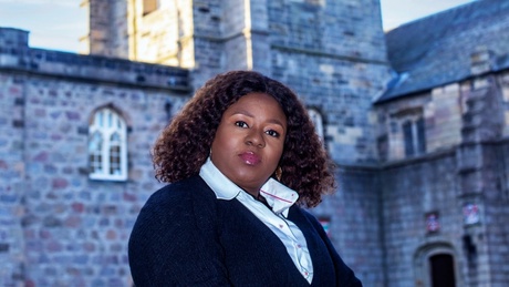 A photo of the Rector, Martina Chukwuma-Ezike, with Kings College Chapel in the background