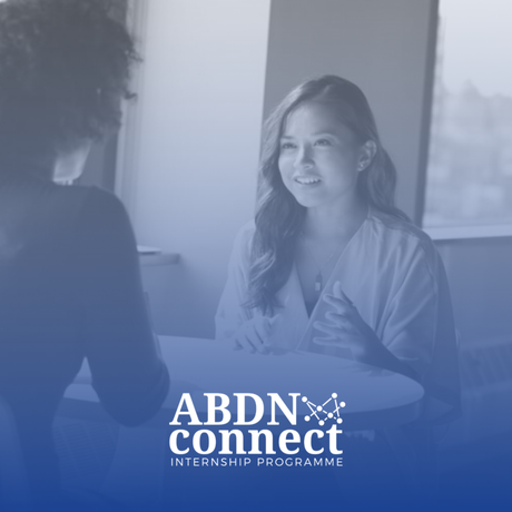 A woman at interview with the ABDNConnect logo