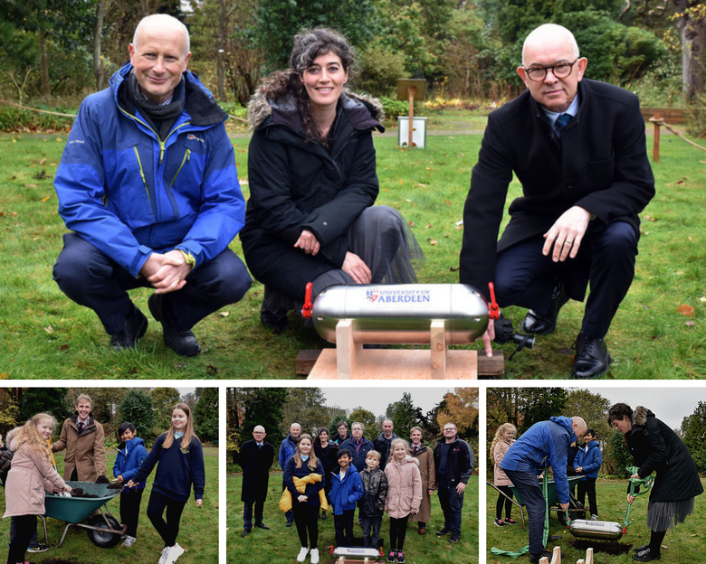 Local schoolchildren with University Principal George Boyne and other University staff burying a time capsule in the University's Botanic Garden.