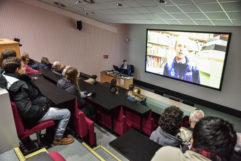 Visitors watch a recorded introduction to the event from Mark Paterson in the Zoology Lecture Theatre