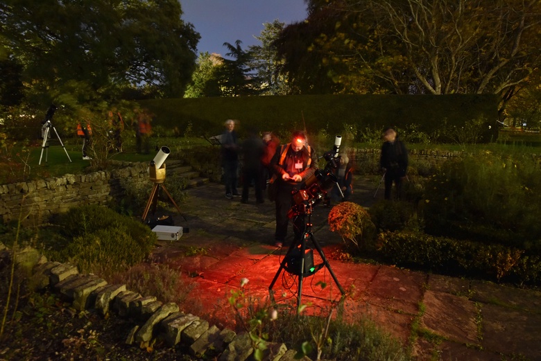 Astronomers with their telescopes in the Rose Garden