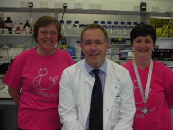 Prof Steve Heys in his lab flanked by two walkers