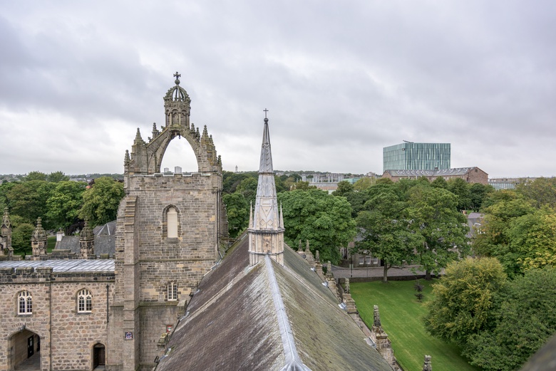 Panoramic view of the crown atop Kings College on Aberdeen's campus, with a view looking toward the modern Sit Duncan Rice library