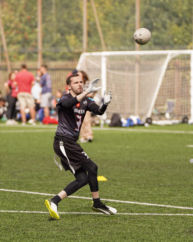 Andy about to catch an American footballl