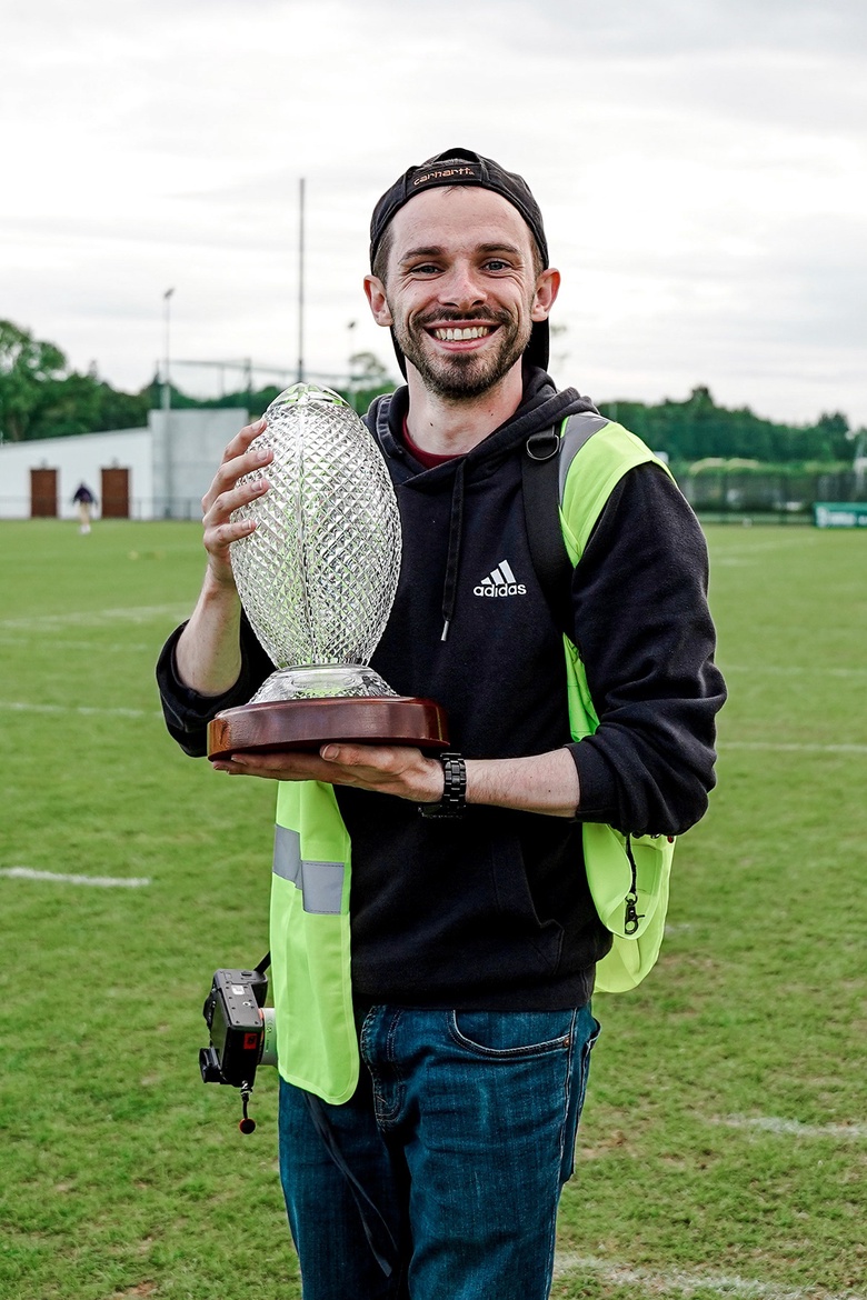 Andy holding an American football