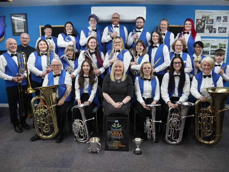 The band standing as a group