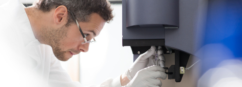 A scientist using a microscope