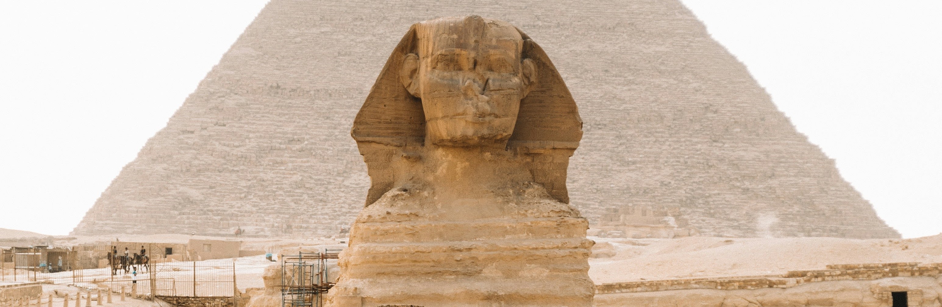 The Sphinx in front of the Pyramids of Giza