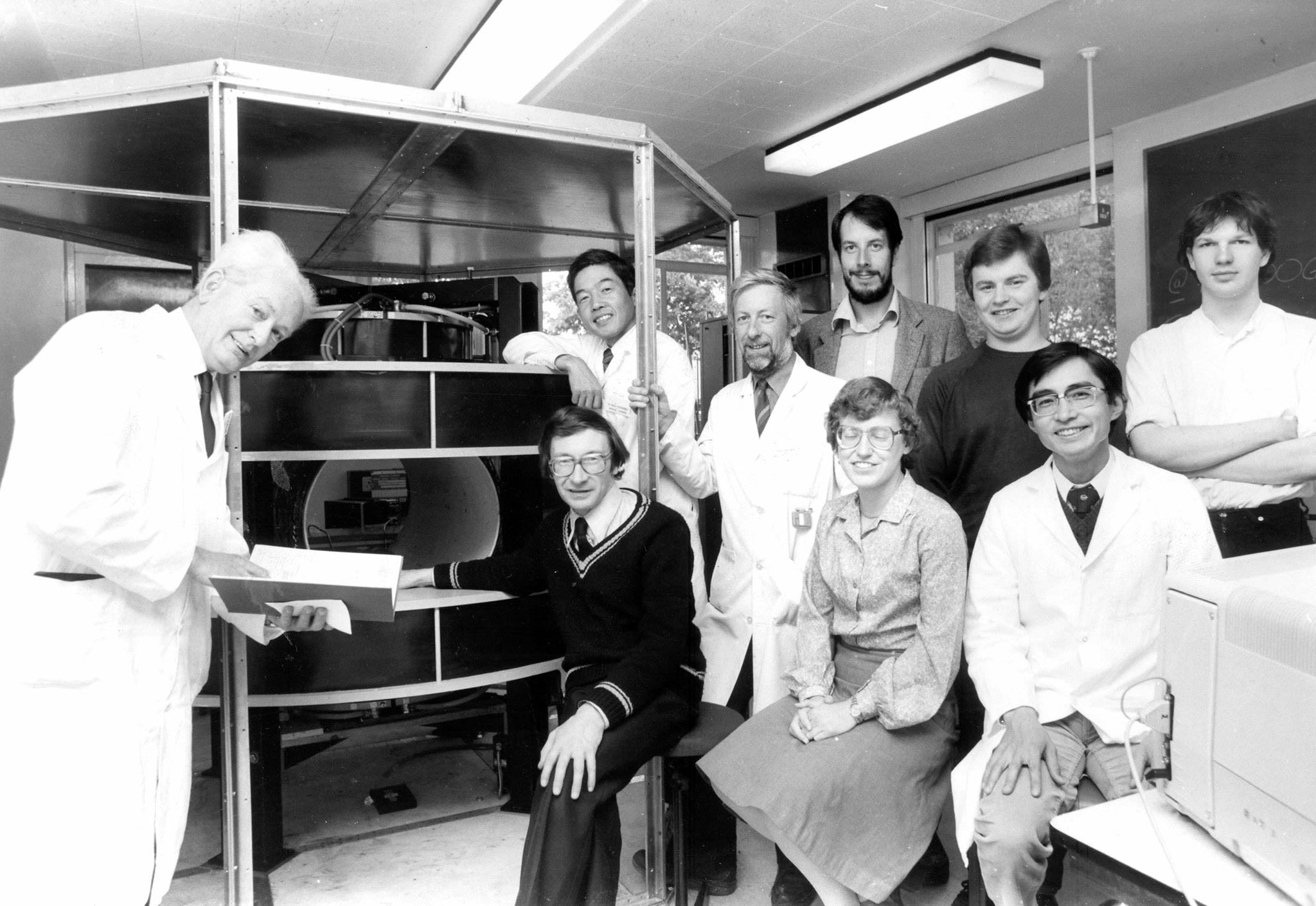 Professors Mallard and Hutchison pictured with a Mark 2 scanner and the Aberdeen MRI Group