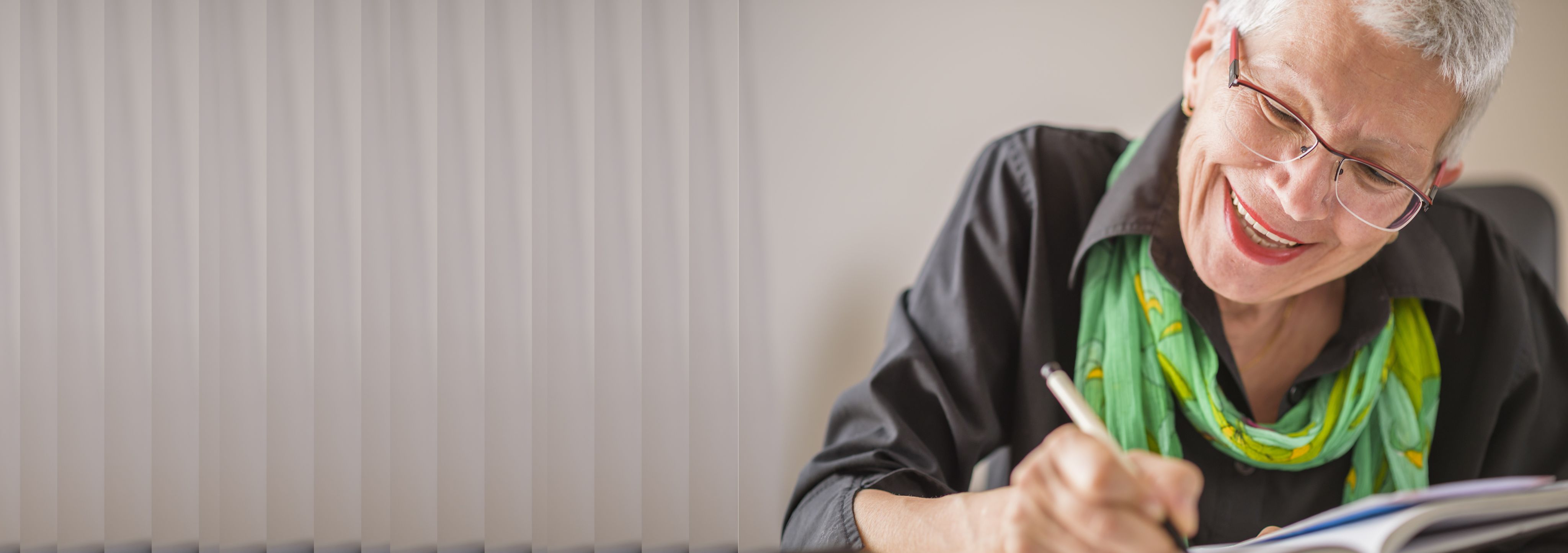 Elderly woman writing